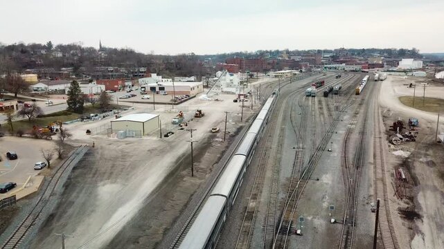 Aerial of the Southwest Chief Amtrak train traveling through a railroad yard near Burlington, Iowa.
