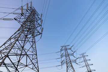 Electricity pylon against a blue sky