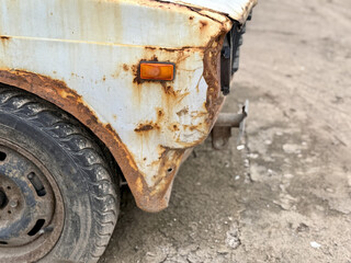 Fototapeta premium Vintage Vehicle Decay, Aged Car Showing Corrosion, Detailed Image Of Deteriorating Vintage Car In Decay Mode, Closeup Photograph Capturing Corrosion And Aging Of Antique Vehicle