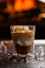 Savor iced coffee topped with ice cream showcasing a delightful blend of flavors at a bustling cafe