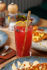 Explore various dishes and drinks from different cuisines, highlighting culinary diversity in a vibrant dining setting