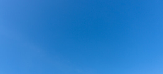Obraz premium Low angle view and full frame of beautiful light blue sky without clouds in the afternoon on sunny day used as natural background texture in decorative art work