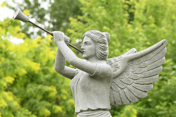 statue of angel blowing in a trumpet © Switch Lab