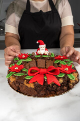 A garland of brownies and cookies with chocolate and a pastry chef in the background_vertical.