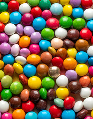 Obraz premium Colorful Candy Coated Spherical Candies Close Up