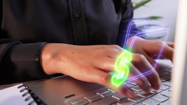 Economic information storage. A female executive's hands focused while working on her laptop with a virtual folder icon with a money symbol.