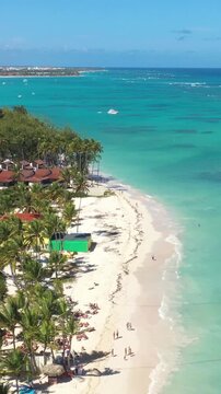Tropical coastline with resorts, palm trees and caribbean sea. Travel destinations. Dominican Republic. Aerial view