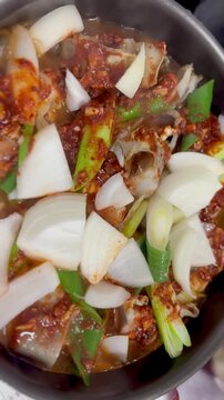 Boiling Spicy Fish Stew With Red Broth In Hot Pot 4K Cinematic Video