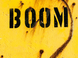 BOOM stenciled on an old oil drum © BJ Clayden