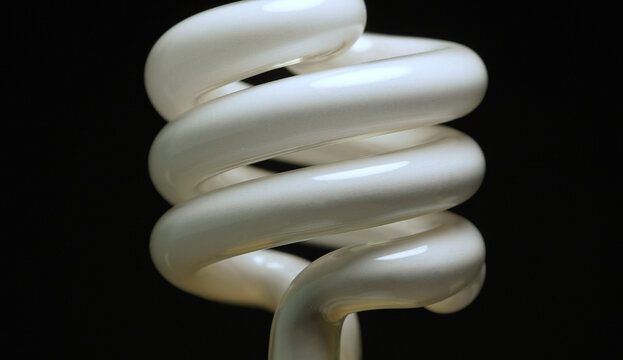 Fluorescent light bulb. Canada&rsquo;s mercury bulb phase-out. Concept image representing environmental regulation, hazardous materials and lighting transition to safer LED bulb alternative use.