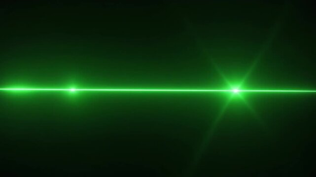 Green laser beam in dark space.