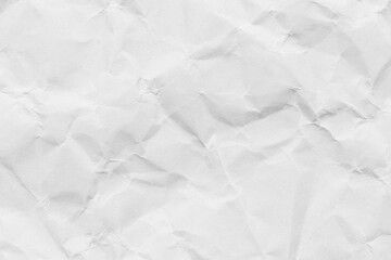 Obraz premium White paper texture background with crumpled effect (macro),Top view of white crumpled paper texture background. Abstract folded paper sheet with creases and wrinkles. Perfect for overlay, design,