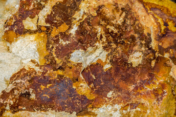 Fototapeta premium Stone structures and grain patterns in reddish brown