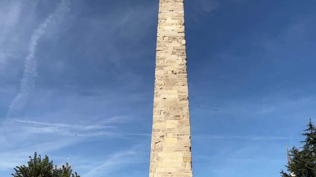 Walled Obelisk or Column of Constantine (Turkish: Orme Dikilitas) on Sultanahmet Hippodrome Square in Istanbul, Turkey. (4K tilt video)