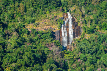 waterfall clear flow motion water on summer to winter on high cliffs and green trees nature forest for relax in natural jungle cascade at Siriphum waterfall Doi Inthanon Chiang Mai in thailand