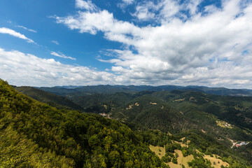 Naklejka premium Mountain and forest with dramatic cloudy sky