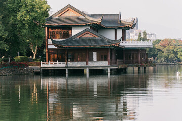 Fototapeta premium Traditional Chinese Pavilion on a Serene Lake, West Lake in Huizhou, Guangdong Province, China, is a tourist attraction featuring ancient architecture.