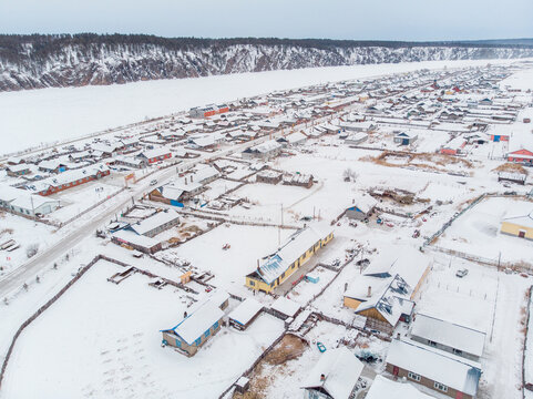 Aerial Winter View of Snow Covered Northern Village