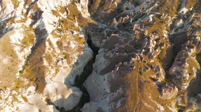 Goreme, Nevsehir, Turkey. Aerial view of ancient volcanic tuff and basalt formations in Pasabag Valley, Goreme National Park, Cappadocia.. Aerial View, MasterShots, Fly Forward - Roll, Tilt up
