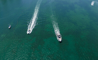 Motorboat sailing at sea. Luxury private yacht in sea. Motor yacht luxury vessel. Boat motor aerial. Vacation on summertime. Aerial view motorboat. Yacht boat tour. Luxury boat yachting