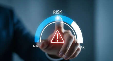 Hand pointing to risk meter indicating high danger in business concept.