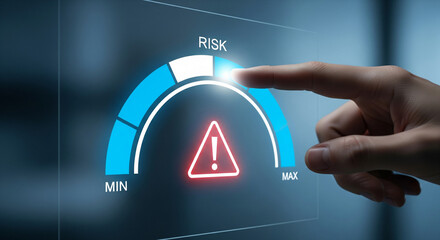 Finger points to high risk on a digital gauge, symbolizing danger and caution.