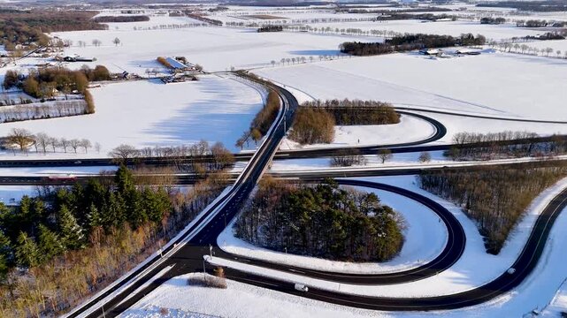 Network Of Looping Ramps Paints Complex Patterns Across Snowcovered Rural Countryside Scenes