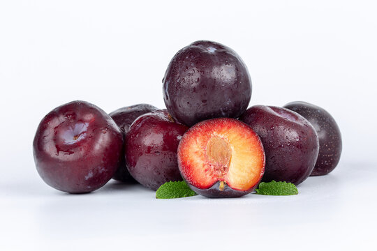 Black Plums On White Clean Studio Background