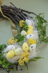 Handmade Easter wreath made of sustainable materials decorations in yellow color. Homemade decor Easter celebration gift present ideas. Copy space Spring holidays 