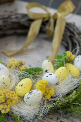 Handmade Easter wreath festive yellow egg decorations. Traditional holiday preparation craft master class of creative making decor. Hands-on activities sustainable responsible holiday gift workshop