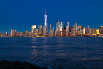 Obraz premium NYC with Manhattan at night. New York skyline in Manhattan. New York city skyline. New York landmark skyline. New York panorama skyline.
