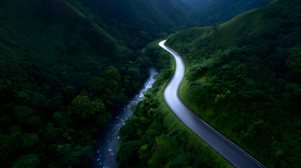 Winding Road Through Lush Landscape: An aerial perspective reveals a serpentine road gracefully weaving through a verdant landscape. The photo captures a sense of journey and tranquility.