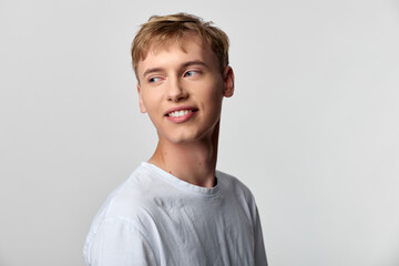Man, smile, white shirt, studio, headshot for fashion and lifestyle stock photography, showing a relaxed casual look in bright, neutral studio lighting and simple background