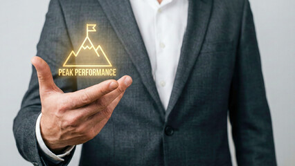 Financial high level planning concept peak performance icon hovering over business hand representing success goal achievement and ambition