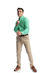 Fototapeta premium Anxious casual man biting lip and holding fists up