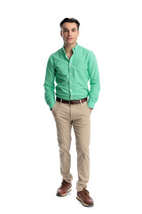 Fototapeta premium Confident young man standing with hands in pockets