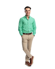 Fototapeta premium Cheerful young man standing with crossed legs