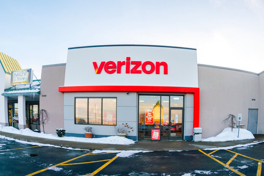 New Hartford, NY - Jan 16, 2026: Fisheye view of Verizon store, a U.S. telecom company founded in 2000, shown with holiday signage and snow-covered storefront at retail location