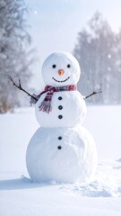 Obraz premium A cheerful, traditional snowman stands outdoors during a light snowfall.