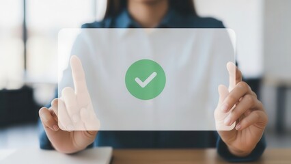 A professional and focused businesswoman engaging with a modern transparent holographic digital interface, confidently activating a vibrant green checkmark icon with both index fingers, set against a