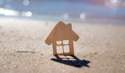 The symbol of the house standing on the seashore
