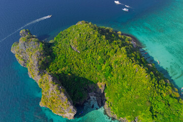 Magical paradise islands with rocks jungle forest on the coast of atoll coral reefs in Andaman Sea view Krabi from above aerial top view drone travel