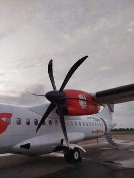 Banjarmasin Airport South Kalimantan Indonesia - January 15, 2026 : ATR 72 - 500 Wings Air ready for departure and pasengers are in queue to boarding
