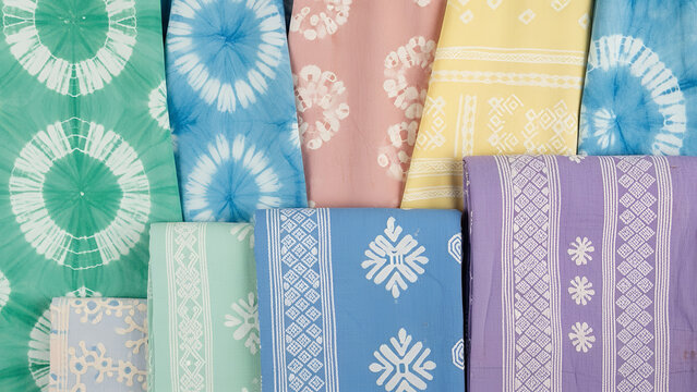 Adire fabric collection featuring colorful patterns and diverse designs showcasing traditional textile art