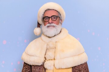 Santa stands with a serious expression wearing a fur coat and hat. A soft blue background adds to the festive feel
