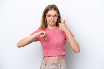 Teenager Russian girl isolated on white background making good-bad sign. Undecided between yes or not