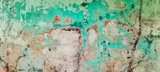 Obraz premium Macro shot of peeling teal paint on old concrete wall, grunge texture background with vintage aesthetic.