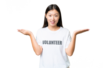 Young volunteer woman over isolated chroma key background with shocked facial expression