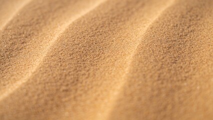 Close-up of fine sand creating wavy patterns in desert landscape  