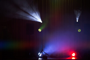 Vibrant light display during an entertainment event in an indoor venue at night